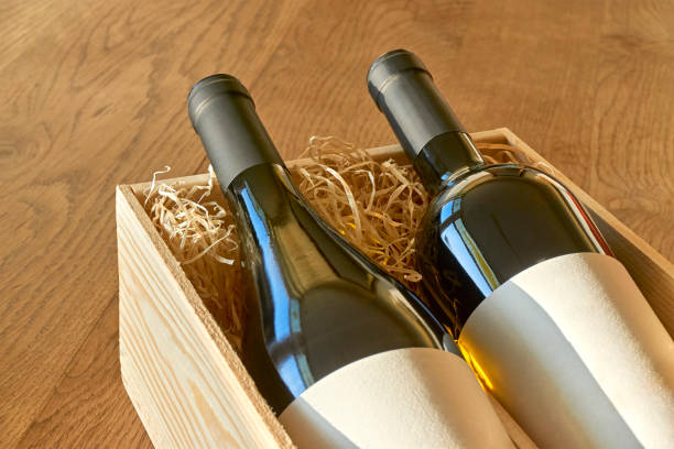istock Wine bottles with blank label in wooden gift box 1196014015