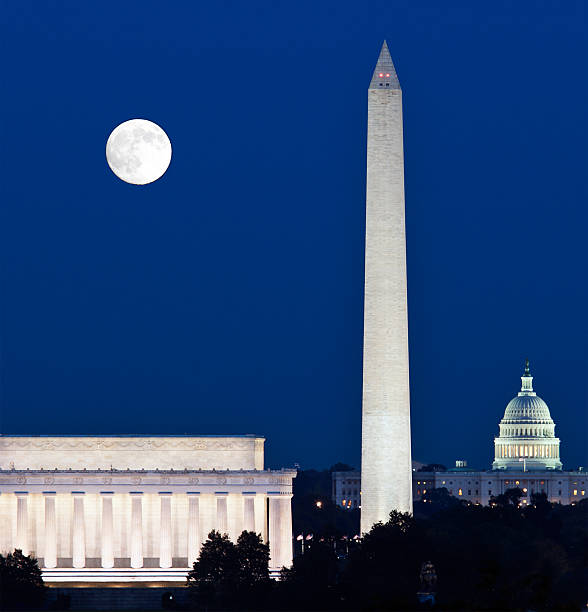 istock Full moon over Washington Memorial with buildings 119601421