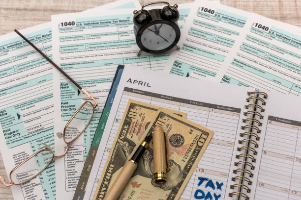 istock US tax form with money. 1196015302