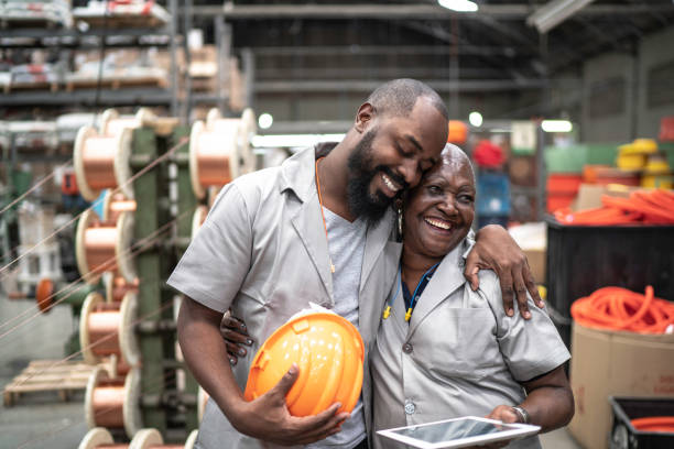 Coworkers embracing in industry