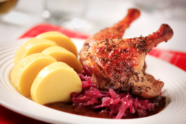 istock Plate of roast duck, red cabbage, and potatoes 119601636