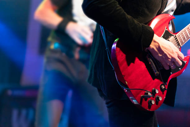 istock Playing guitarist on the stage 1196017265