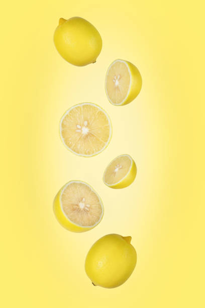 istock Falling lemon isolated on yellow background with clipping path as package design element and advertising. Flying fruits. 1196018005