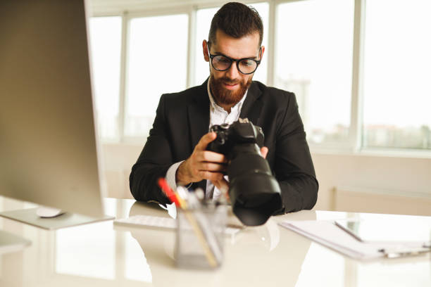 istock Photographer with his photo camera 1196019028