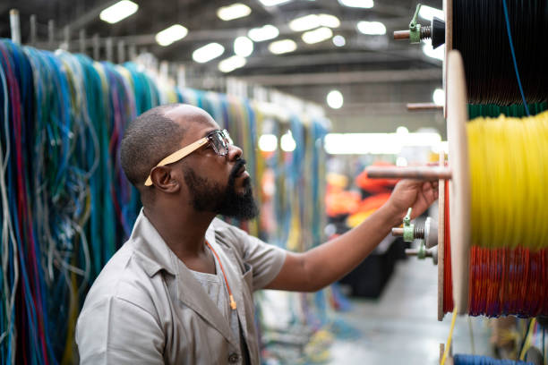 istock Employee working with wires in industry 1196019101