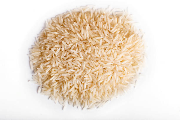 istock Pile of  basmati rice isolated on white background.  Top view. 1196019785