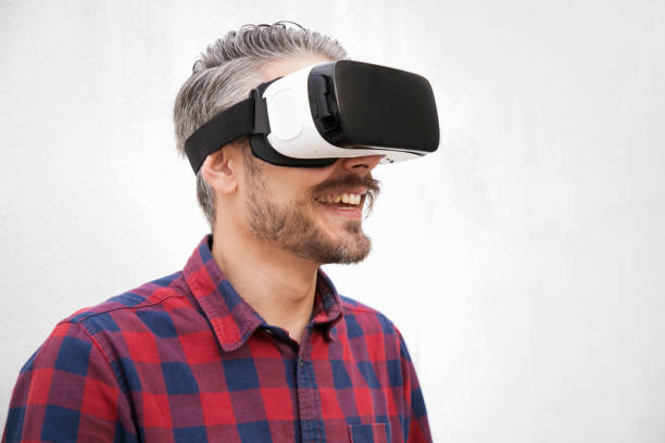 istock Close-up view of cheerful man in VR headset 1196019938
