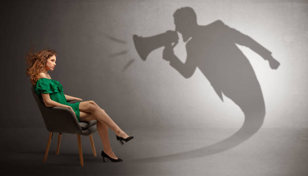 istock Dark shadow yelling to elegant lady 1196021813