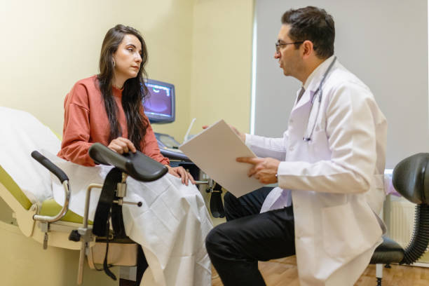 Young woman patient with a senior gynecologist during the consultation in the gynecological office Young woman patient with a senior gynecologist during the consultation in the gynecological office cervix photos stock pictures, royalty-free photos & images