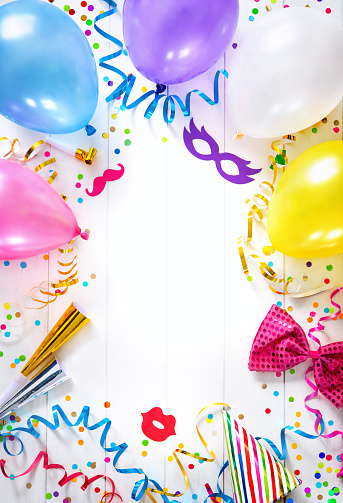 Background for carnival, birthday, New Year or other festivities with air balloons, streamers, confetti and party accessoires