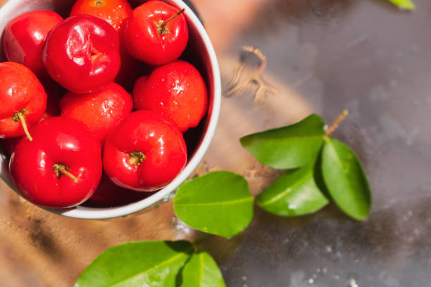 istock Acerola fruit in a bowl at table on garden, typical Brazilian fruit concept image. 1196023267