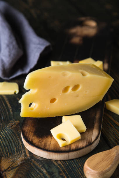 istock A piece of cheese on a cutting board 1196025387