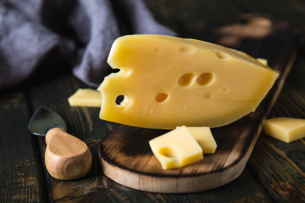 istock A piece of cheese on a cutting board 1196025442