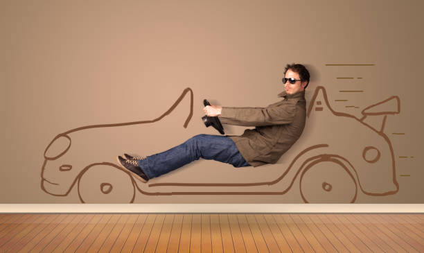 istock Happy man driving an hand drawn car on the wall 1196026103
