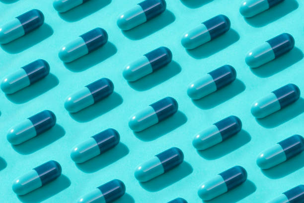 istock Blue Medicine Capsules 1196027394