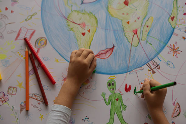 istock Children's drawing of planet Earth 1196028367