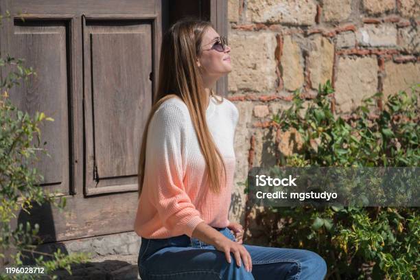 Young Pretty Women Waiting Old Rustic Entrance Door Stock Photo - Download Image Now