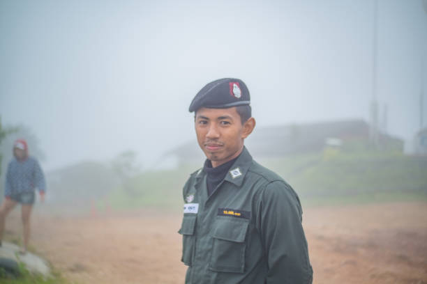 kanchanaburi/Thailand-1 July 2017:Young soldier on Military Command base on Chang suek Hill the border between Thailand-myanmar at Thongphaphum district kanchanaburi city Thailand.Heavy fog
