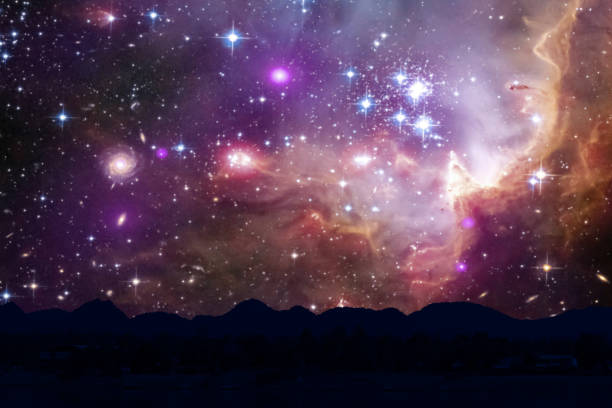 istock nebula and galaxy on space back on silhouette mountain hill and night sky 1196032124