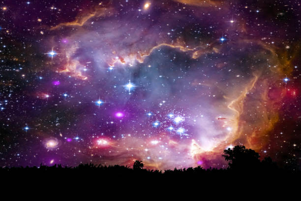 istock nebula and galaxy on space back on silhouette mountain hill and night sky 1196032254