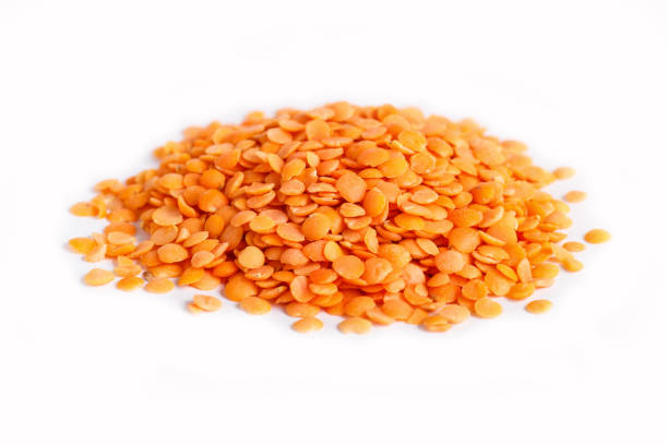 istock Pile of  red lentils isolated on white background. Closeup. 1196033761