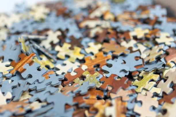 istock Mixed jigsaw puzzle pieces background, macro close up 1196038751