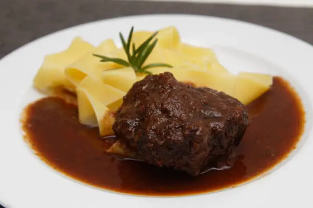 Braised ox cheeks with noodles