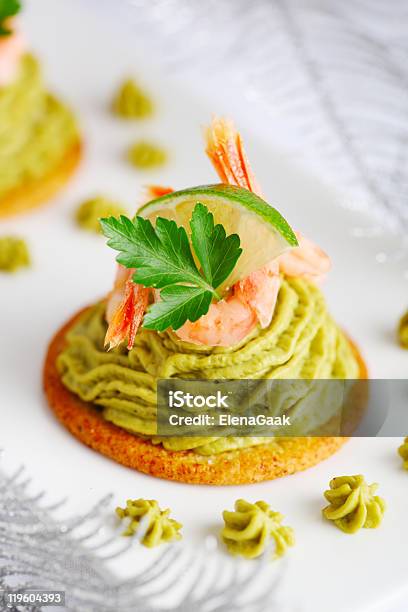 Avocado Cream And Prawns On Crackers For Christmas Stock Photo - Download Image Now - Appetizer, Avocado, Christmas
