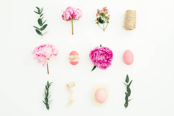 istock Ester holiday composition with eggs, pink peonies and eucalyptus branches on white background. Flat lay, top view 1196045146