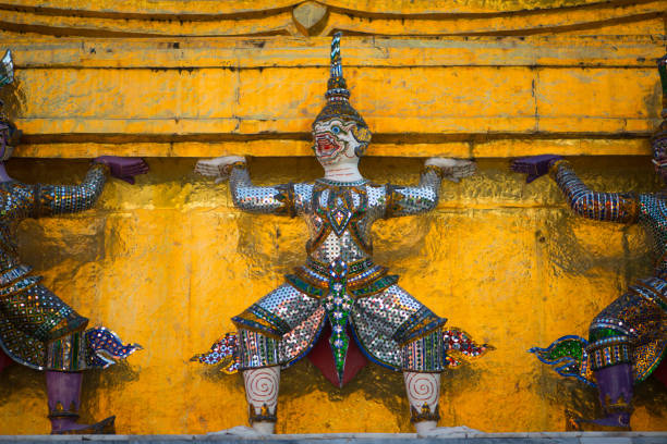 Details giant sculpture in Wat Phra Kaeo, Temple of the Emerald Buddha, Bangkok, Thailand.
