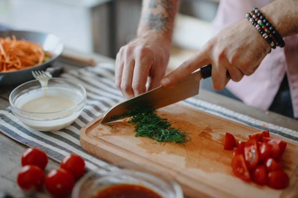 istock Close up of chef cutting parsley 1196045571