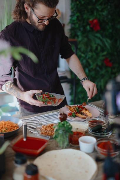 istock Chef serves sweet baked potatoes into plate 1196046141