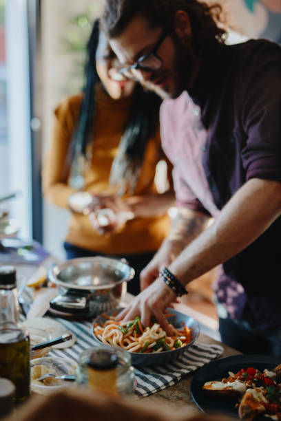 istock Friends preparing vegetarian food together 1196046227