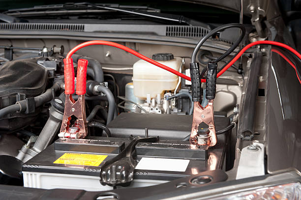 Automobile battery charging  jumper cable stock pictures, royalty-free photos & images