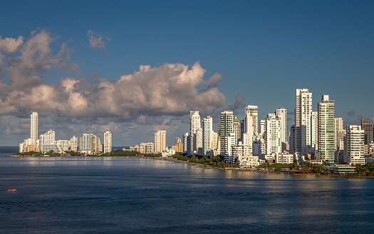 View from the seaside of the marina and tall apartment buildings in the modern section of Cartagena de Indias, Colombia.