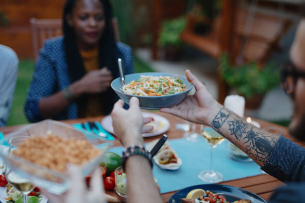 istock Millennial friends having vegan dinner 1196048951