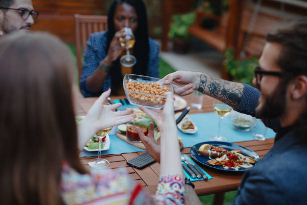 istock Millennial friends having vegan dinner 1196048966