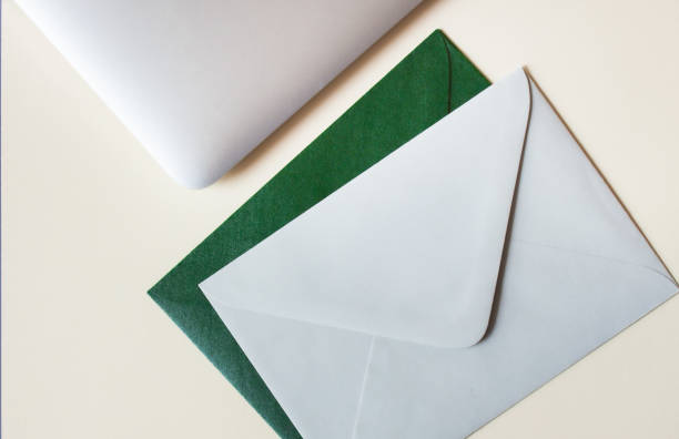 istock Colorful envelopes, laptop and cardboards on table. Mockup. Office concept. 1196050796