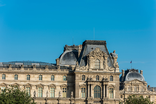 The rooftop of Louvre Museum at the right bank of Seine Rive, the world's largest art museum and a historic monument in Paris, France. A central landmark of the Paris city.