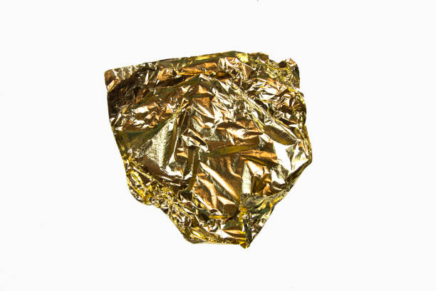 istock Texture of gold paper sheet isolated on white 1196053526