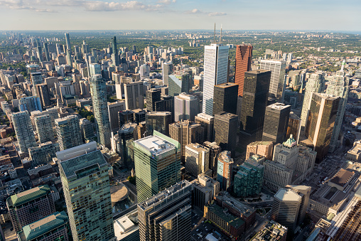 Wide angle view of warm sunlight illuminating the cityscape Toronto, Ontario, Canada.