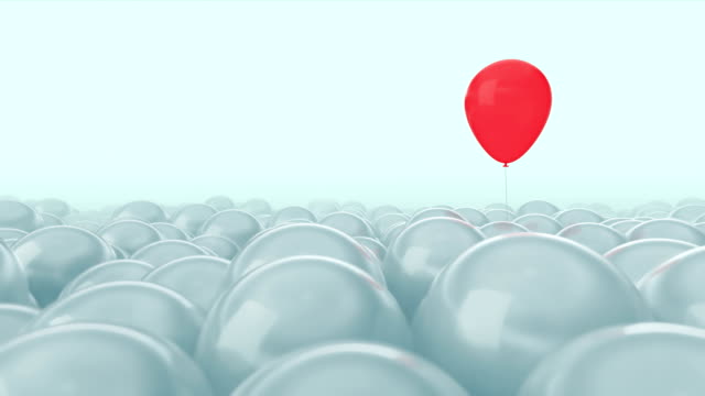 One red balloon is opposed by many other balloons. Bright blue light background. Ideal title text background. One against all. Concept ideas. The concept of personality. Use mask to easy change color.