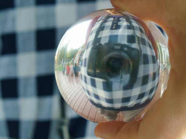 Camera had been reflected in clear glass crystal ball