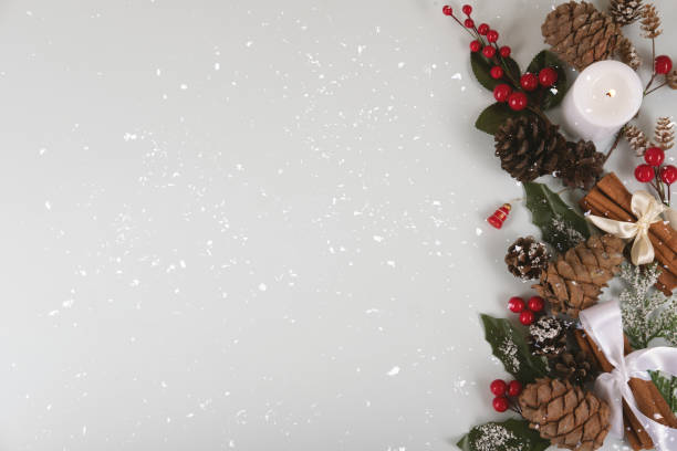 istock Christmas decorations with one candle in snow. 1196057271