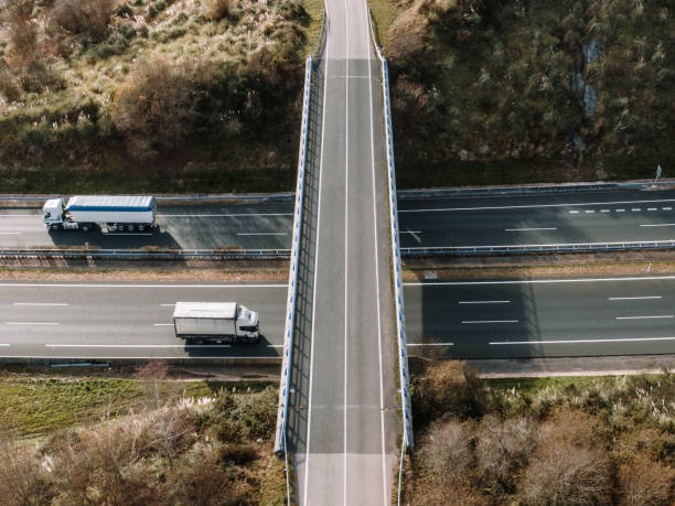 istock Highway with trucks as seen from above 1196060069