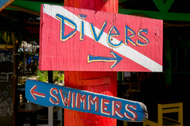 Divers and Swimmers Sign at a Caribbean Dive Shop stock photo