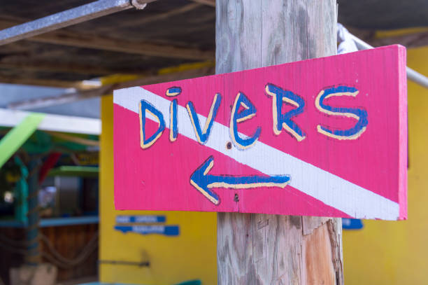 Divers Sign at a Caribbean Dive Shop stock photo