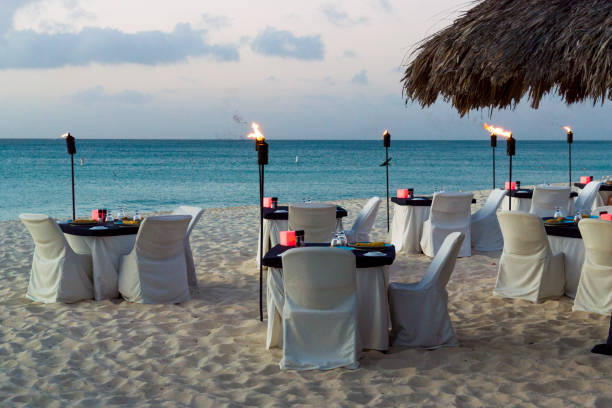 istock Luxury Evening Dining on White Sand Beach Paradise 1196060405