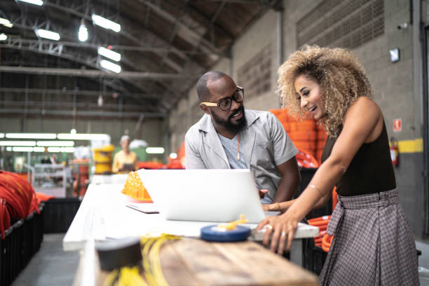 istock Engineer and manager working together with laptop in the industry 1196061410