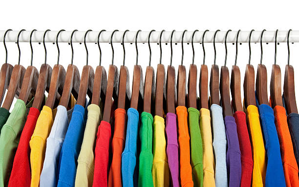 istock Multicolored clothes on wooden hangers 119606201